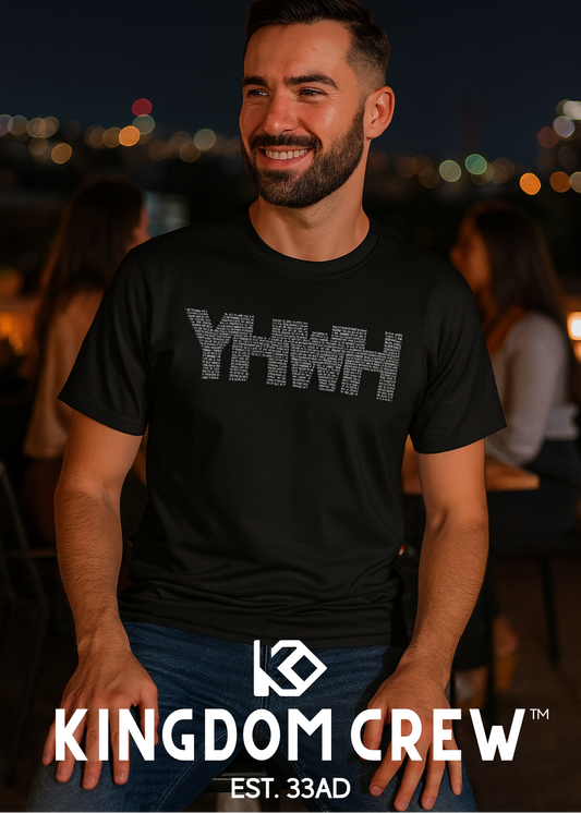 Man wearing a black t-shirt with 'YHWH' printed on it, standing in a social setting with 'Kingdom Crew' branding.