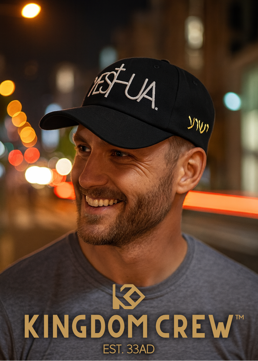 Man wearing a kingdom crew black cap with 'YESHUA'