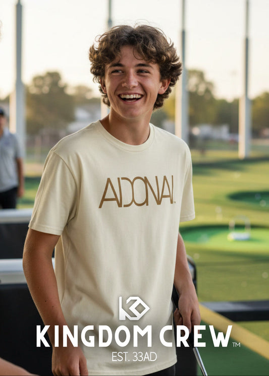 Person wearing a 'KINGDOM CREW' t-shirt with a golf course in the background