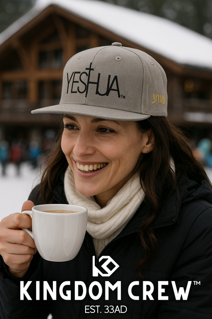 Woman wearing a 'YESHUA' cap and holding a mug, with 'Kingdom Crew' branding.