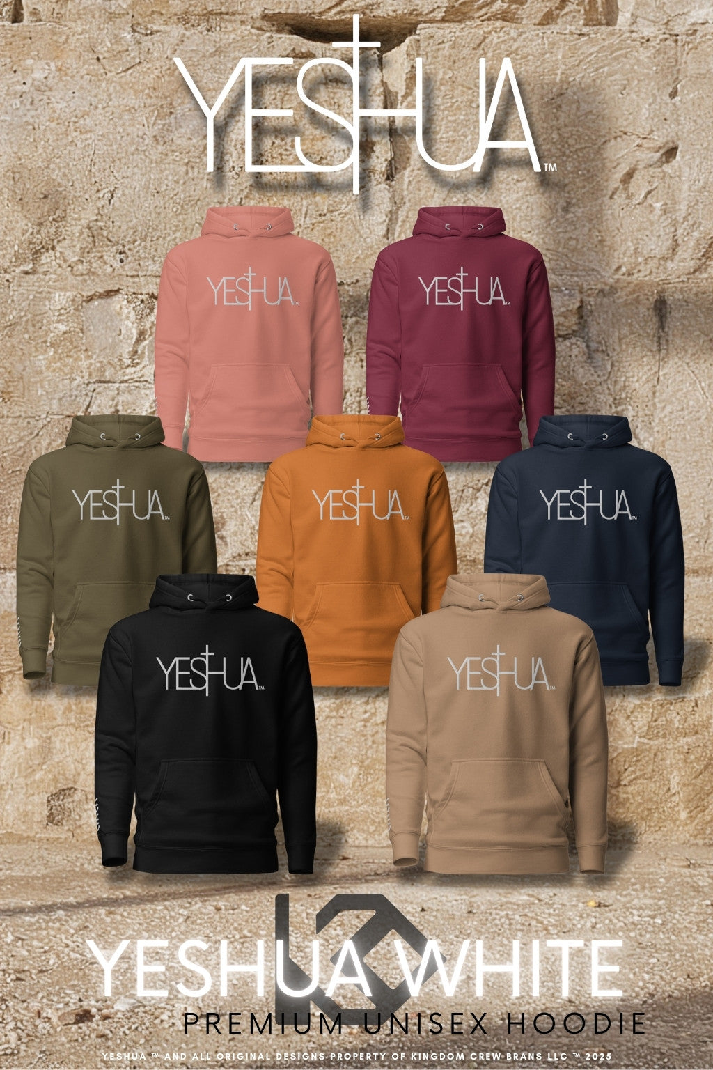 Yeshua White Premium Unisex Hoodie collection by Kingdom Crew™ displayed on stone wall background featuring embroidered white lettering design and multiple color variants from the Sacred Name Collection honoring Yeshua
