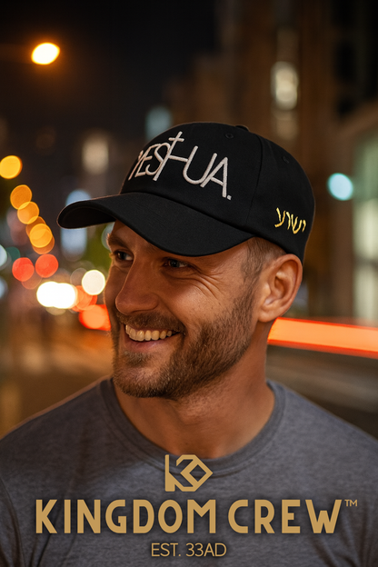 Man wearing a kingdom crew black cap with 'YESHUA' 