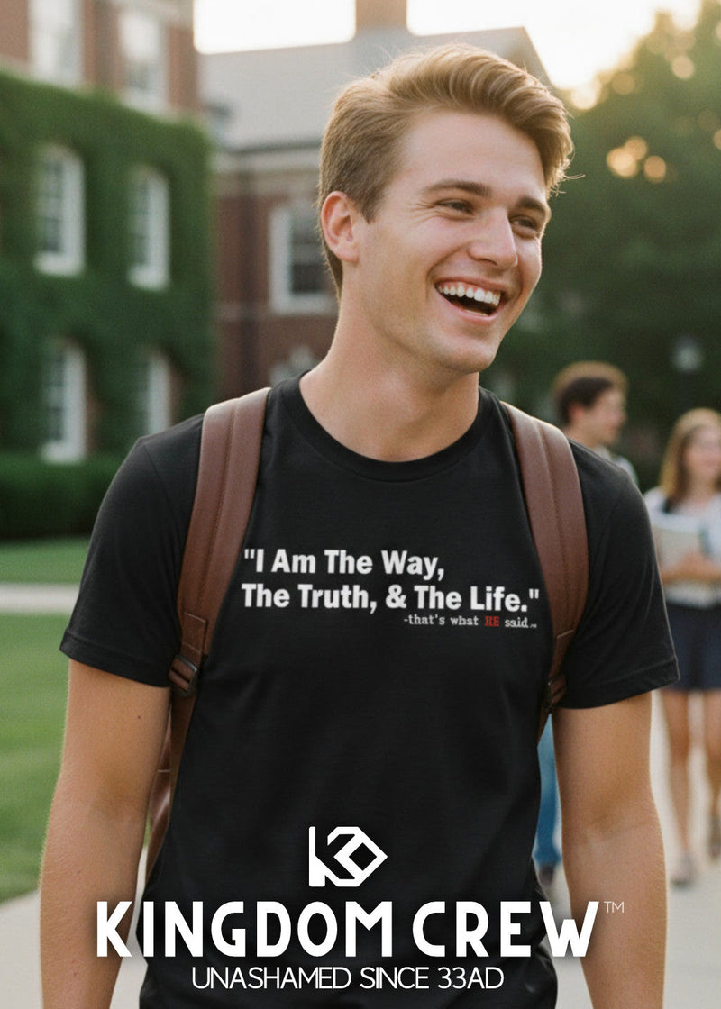 Man wearing a black t-shirt with a quote and Kingdom Crew logo, standing outdoors.