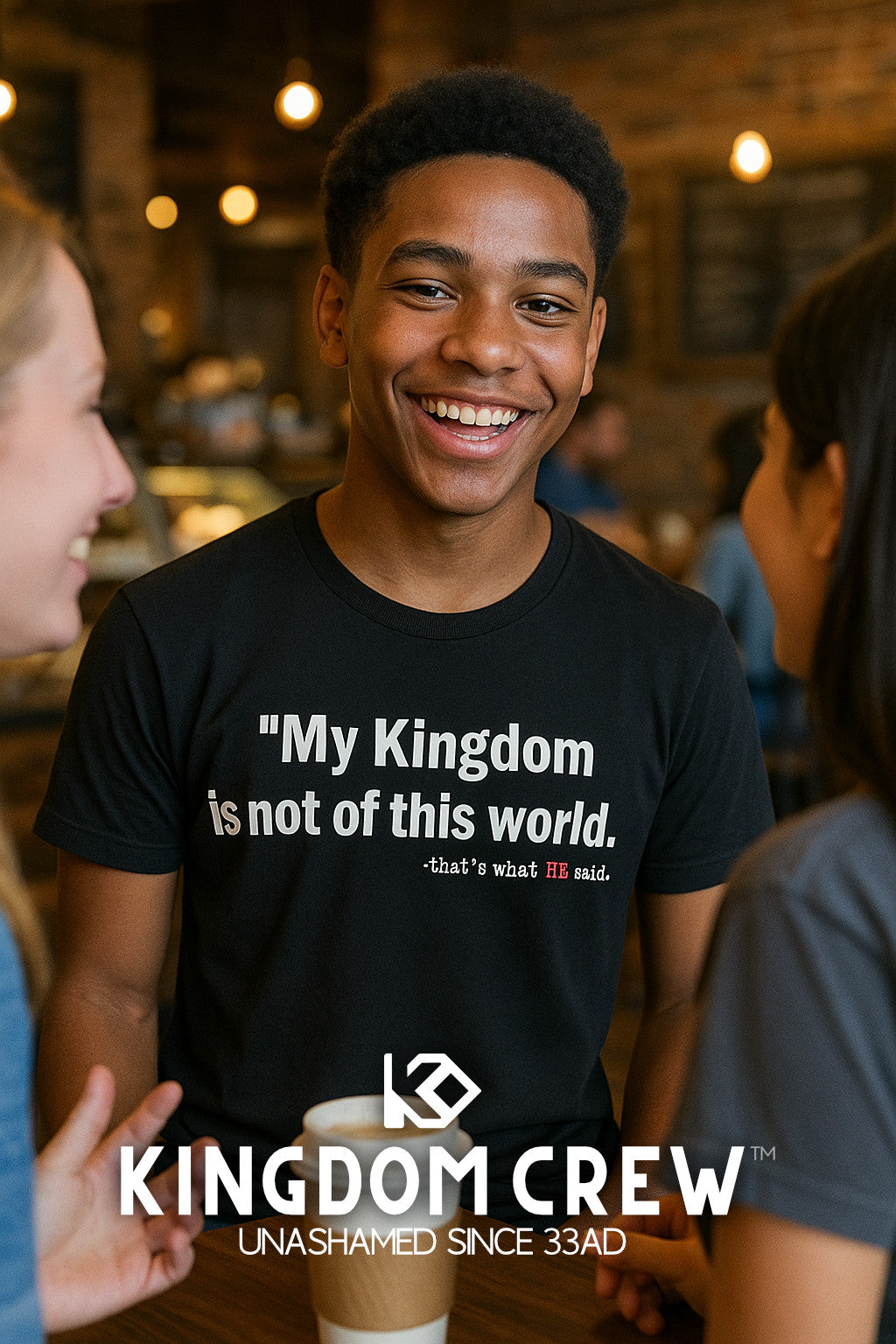 Person wearing a black t-shirt with text, standing in a casual setting with 'Kingdom Crew' branding.