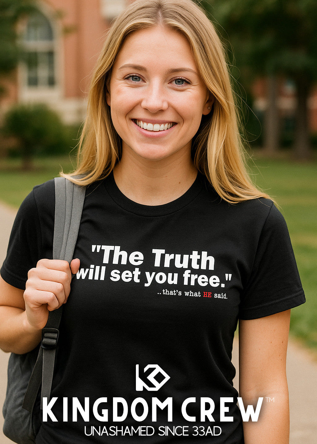 Person wearing a black t-shirt with 'Kingdom Crew' text and logo outdoors.